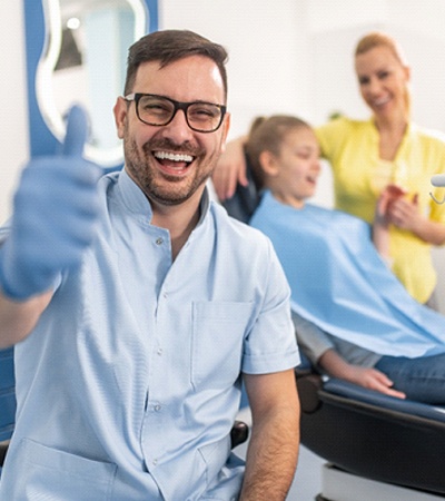 family dentist in Center giving a thumbs-up