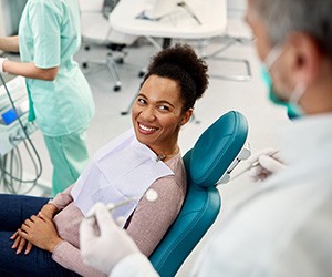 Woman smiling at dentist during visit