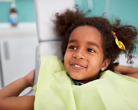 Girl smiling in the treatment chair