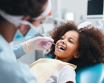 Little girl receiving a dental checkup