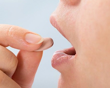 Person taking oral conscious sedation in Center