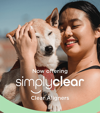 Branded SimplyClear image, showing woman cuddling with her dog