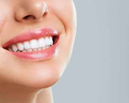 Close-up of woman’s smile with beautiful white teeth